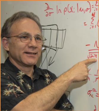 Dr. Paul Gader points to a set of equations on a whiteboard