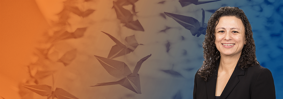 Dr. Elif Akcali profile picture, superimposed over paper cranes